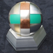 The MaP Award: A sphere made from 12 different materials (on a metal socket)
