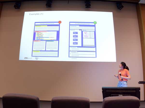 Nadia Enrriquez presenting (a woman in an orange shirt looking up to the screen from the lower right corner)