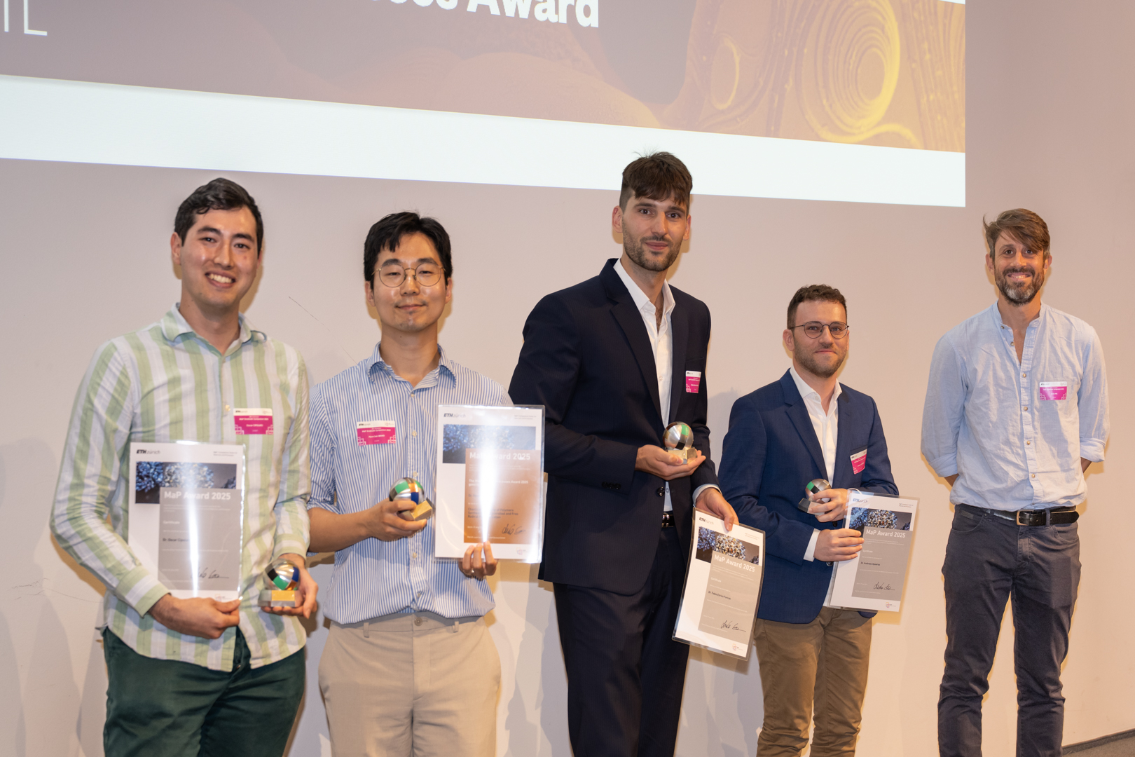 4 MaP Award finalists and Prof. Lucio Isa on stage at the MaP Graduate Symposium