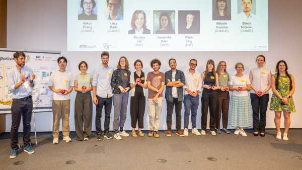 Group picture of the organising committee (about 14 people on stage)