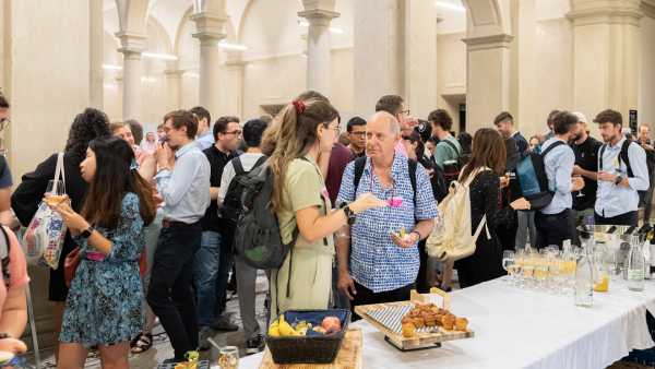 People gathering in front of a buffet