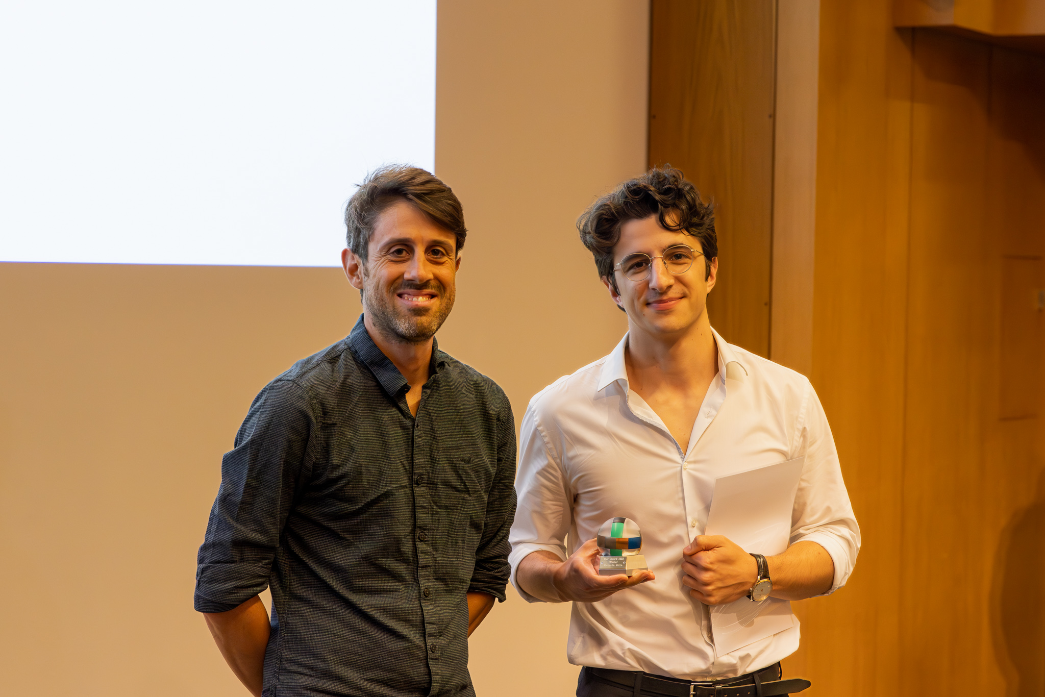 Prof. Lucio Isa and Dr. Riccardo Rizzo, Winner MaP Award 2023. Riccardo Rizzo holding the MaP Award puzzle ball.
